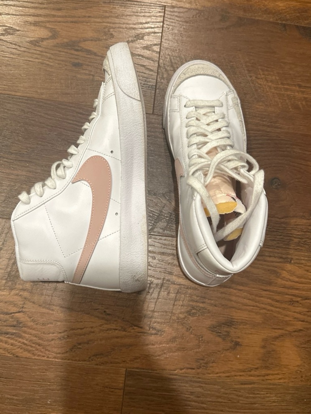 Nike Women's White High-Top Sneakers with Pink Swoosh Accent